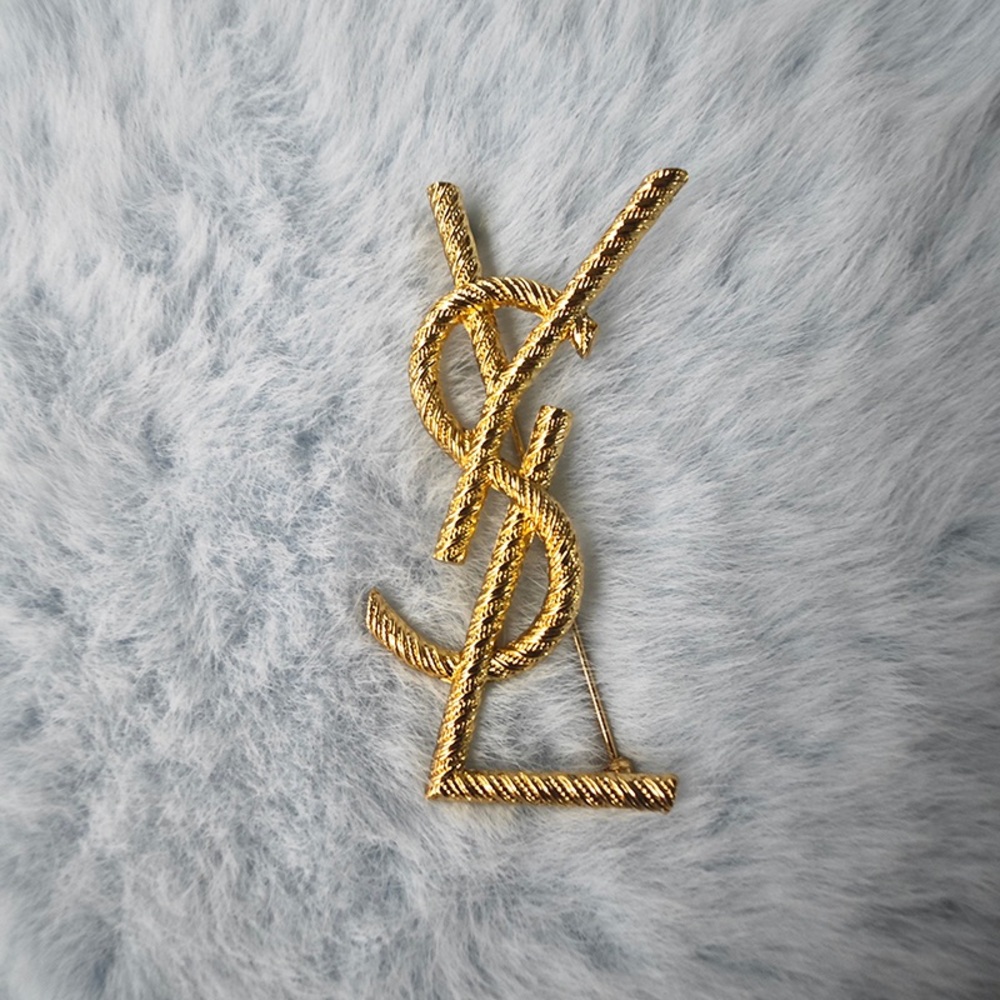 Yves Saint Laurent gold brooch for women